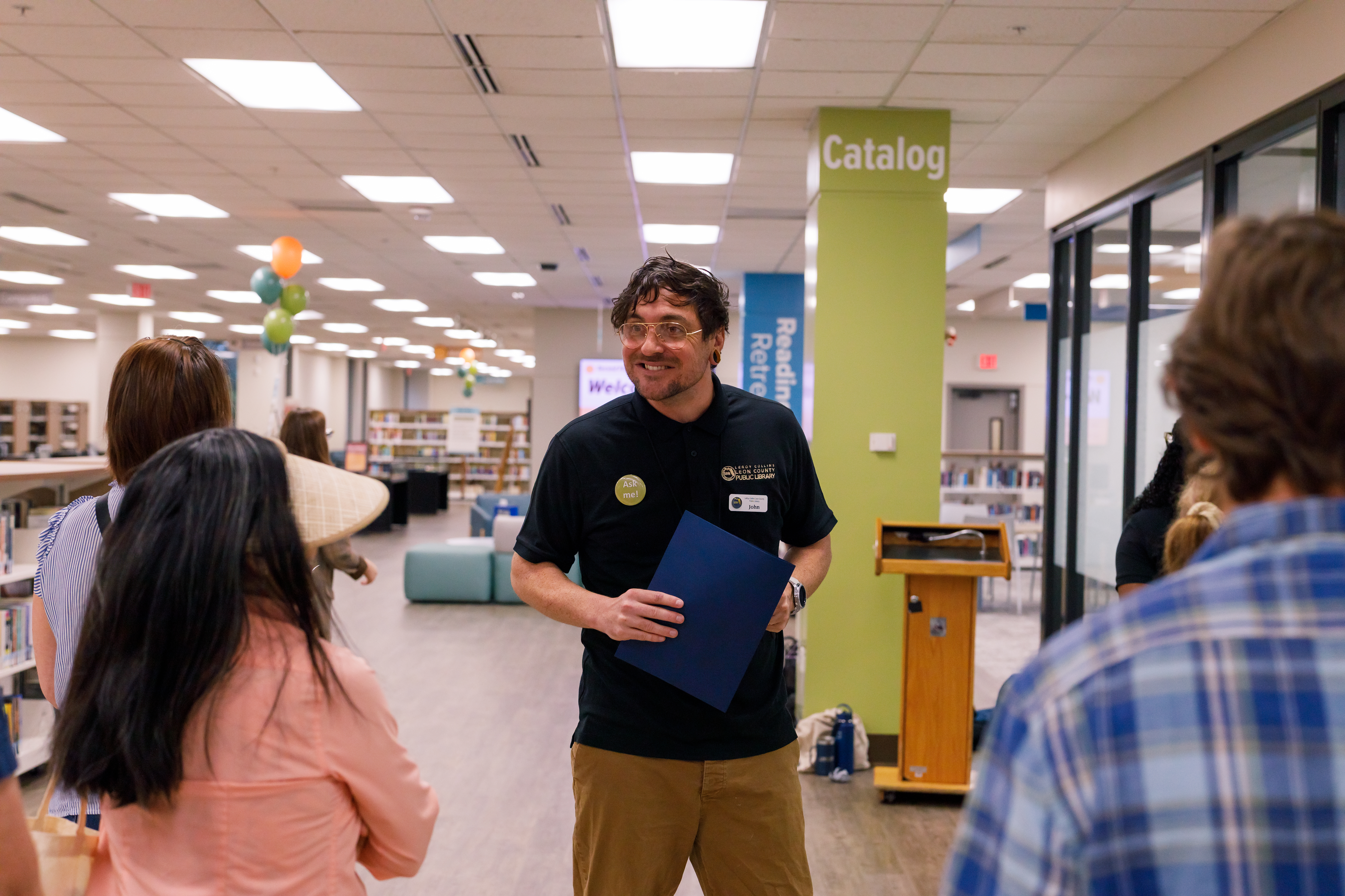 Library staff giving a tour of the Main Library's second floor renovations.